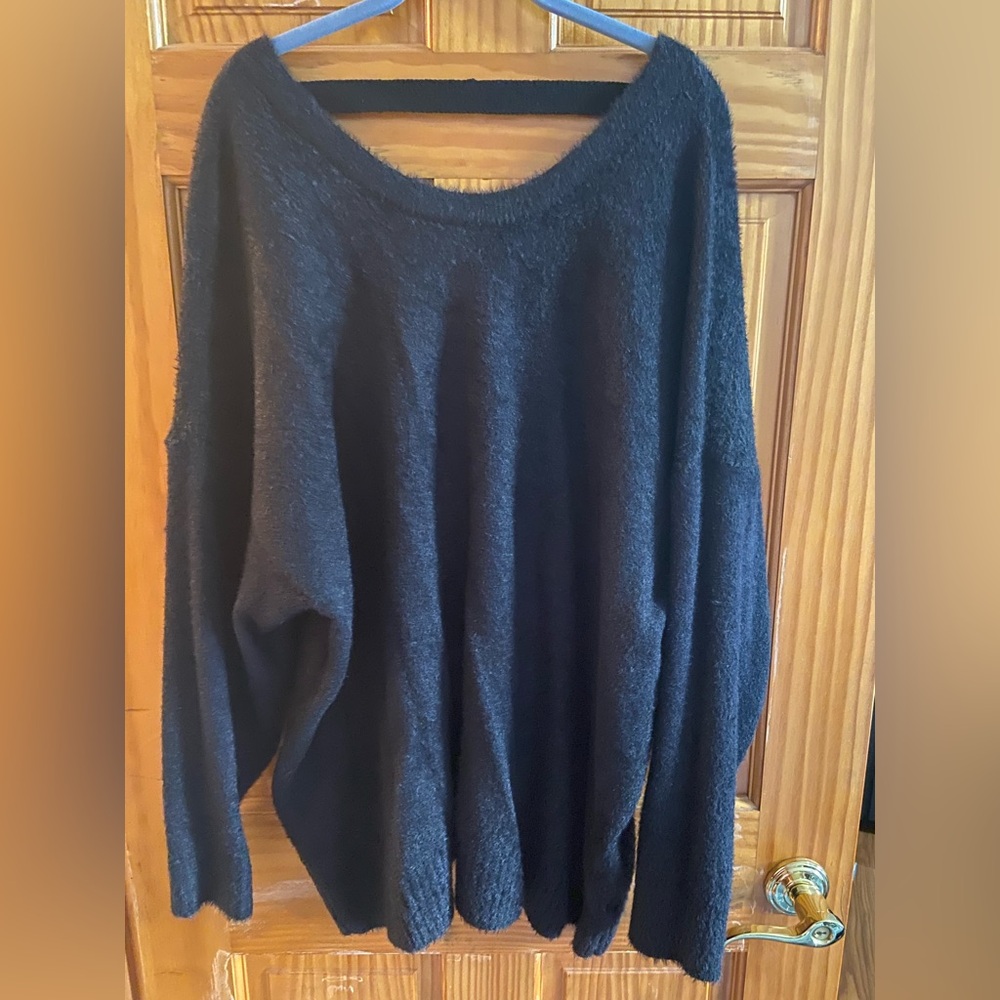 Black sweater with “v” back.